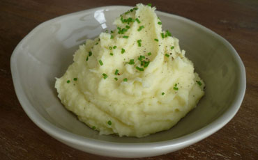 Puré de papas + aceite de trufas negras